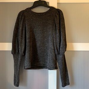 Soft sweater with puff sleeves.